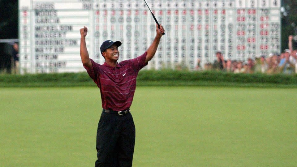 Woods celebrates sealing his second US Open title in 2002 after a three-shot victory at Bethpage Black in Farmingdale, New York. - Timothy A. Clark/AFP/Getty Images