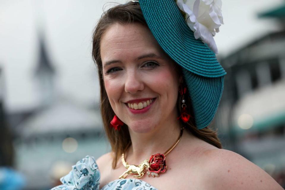 Michelle Grimmer wears a gold and red necklace that she handmade for Derby Day at Churchill Downs in Louisville, Ky., Saturday, May 4, 2024. She used brooches and added them to a necklace to have the horse “running for the roses.”