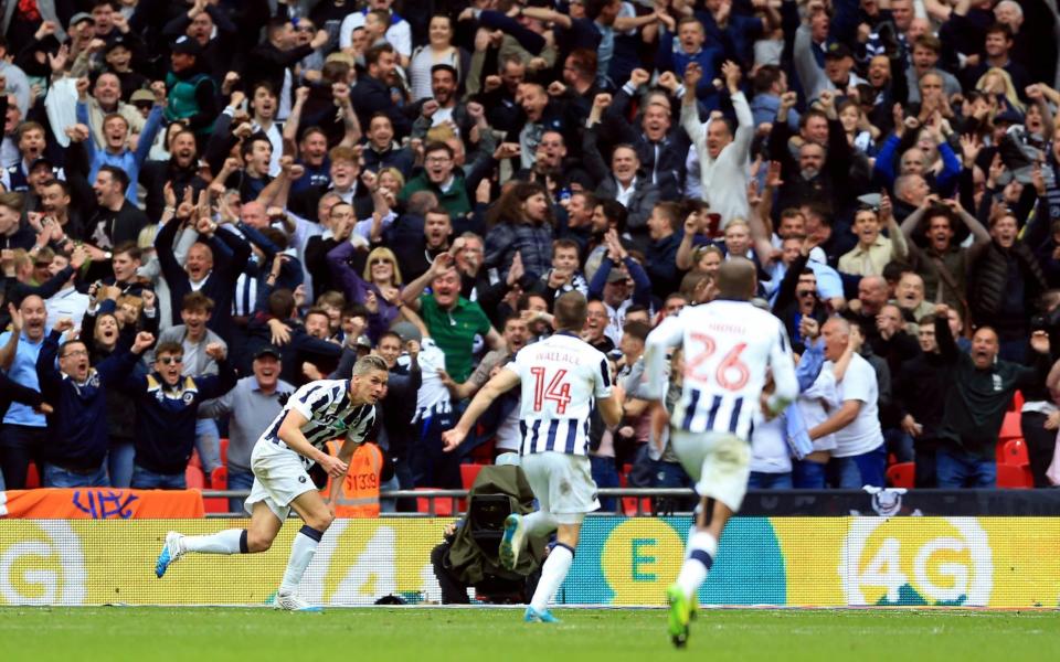 Steve Morison wheels away to celebrate his 85th minute strike - PA