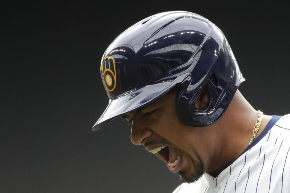 Milwaukee Brewers' Eduardo Escobar reacts after reaching base on a throwing error during the seventh inning of a baseball game against the New York Mets, Sunday, Sept. 26, 2021, in Milwaukee. Two runs scored on the play. (AP Photo/Aaron Gash)