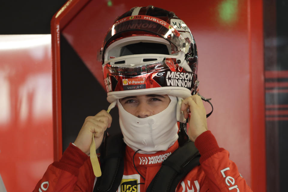 Ferrari driver Charles Leclerc of Monaco wears the helmet during the second free practice at the Yas Marina racetrack in Abu Dhabi, United Arab Emirates, Friday, Nov. 29, 2019. The Emirates Formula One Grand Prix will take place on Sunday. (AP Photo/Luca Bruno)