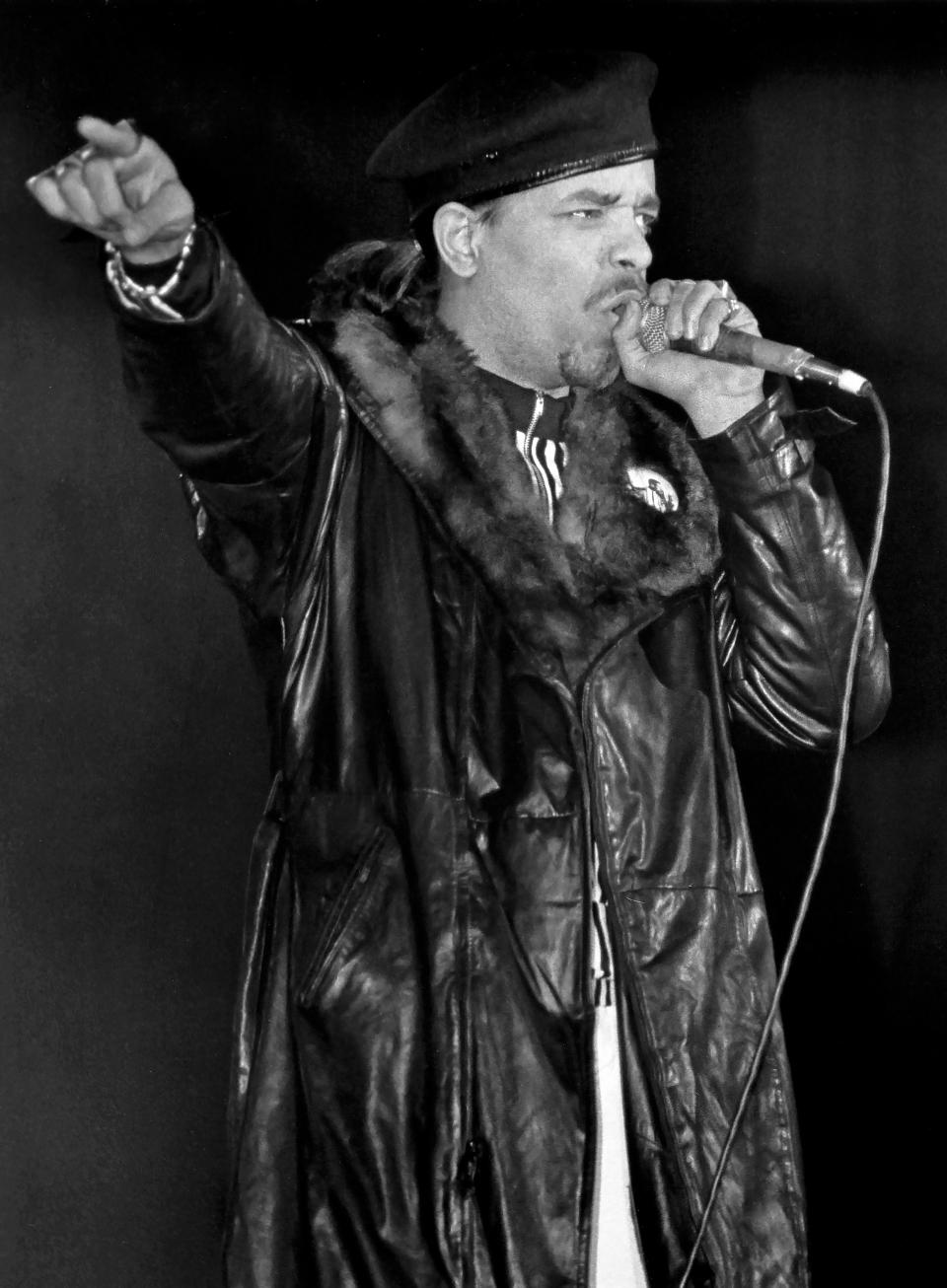 Ice-T holds a microphone while rapping at a concert. (Raymond Boyd / Getty Images)