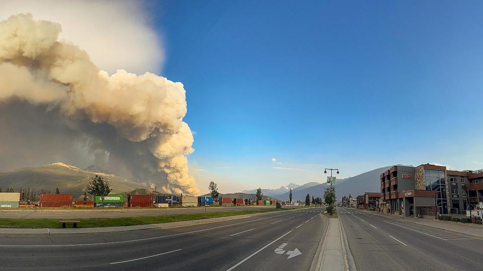 PHOTO: In this July 24, 2024, image obtained from the Jasper National Park in Canada, smoke rises from a wildfire burning in the park.  (Handout/Jasper National Park/AFP via Getty Images)