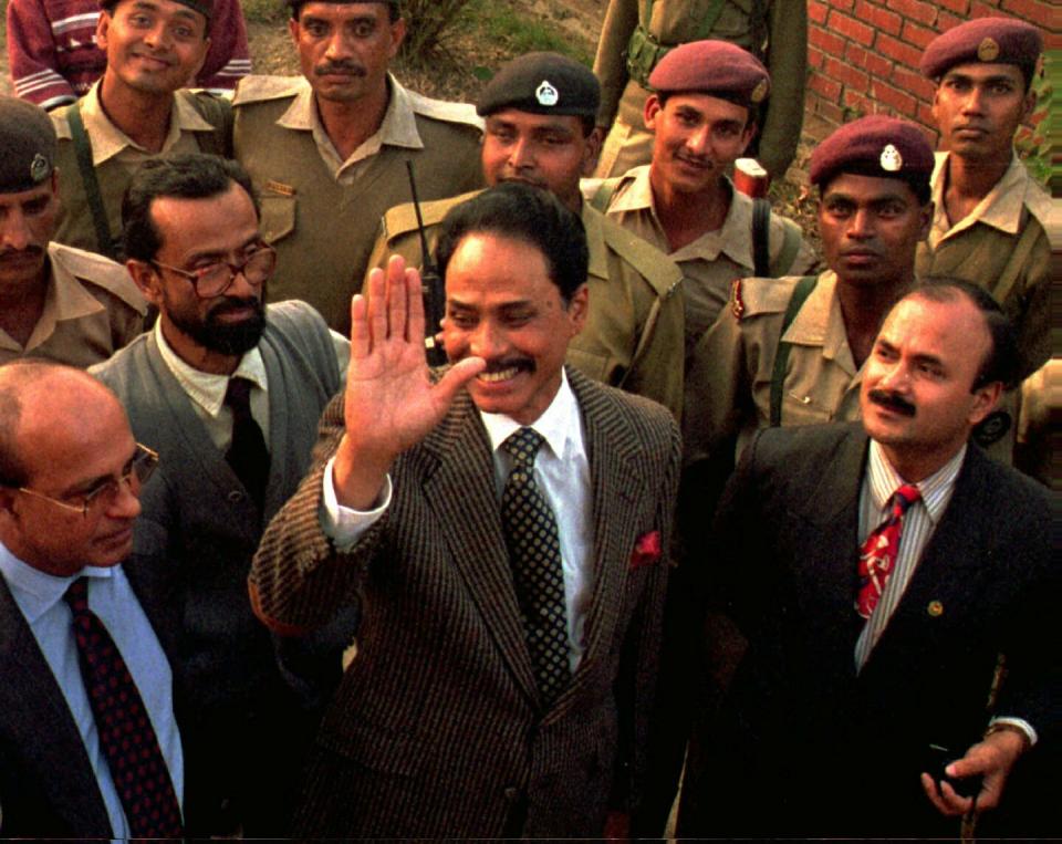 FILE- In this Jan. 9, 1997 file photo former Bangladesh president Hussain Muhammad Ershad, waves to supporters as he is released from government prison in Dhaka, Bangldesh. The former military dictator who seized power in a 1982 coup, has died. He was 91. (AP Photo/Pavel Rahman, File)