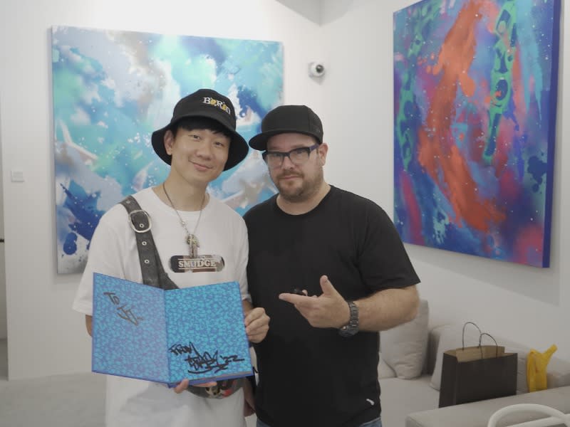 Singapore singer-songwriter JJ Lin with Stash at the exhibition in Singapore. 