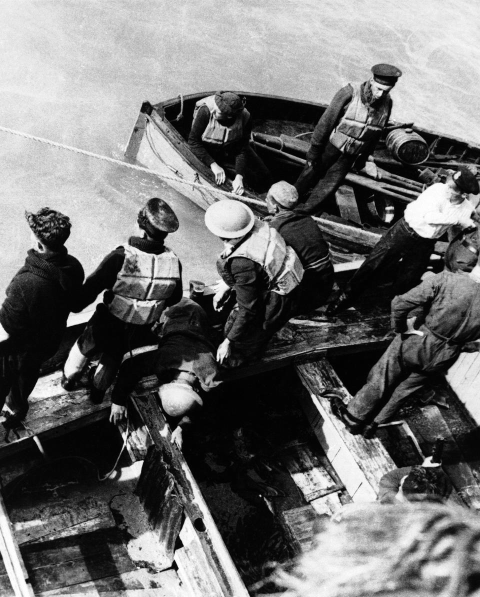 As bombs were bursting and Nazi machine-gun bullets were raining down on the beach at Dunkirk soldiers took what cover they could find in the unprotected sands. Rescuers help a soldier aboard in France on June 8, 1940.