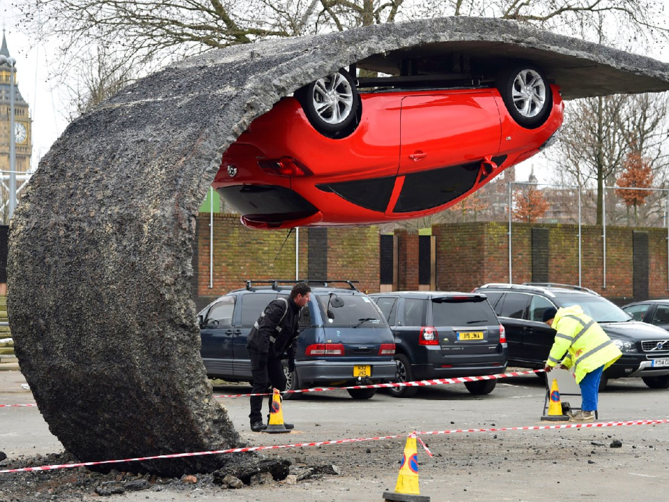 red car upsided down backward