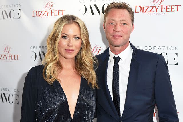 <p>Angela Weiss/Getty</p> Christina Applegate and Martyn LeNoble in 2015.