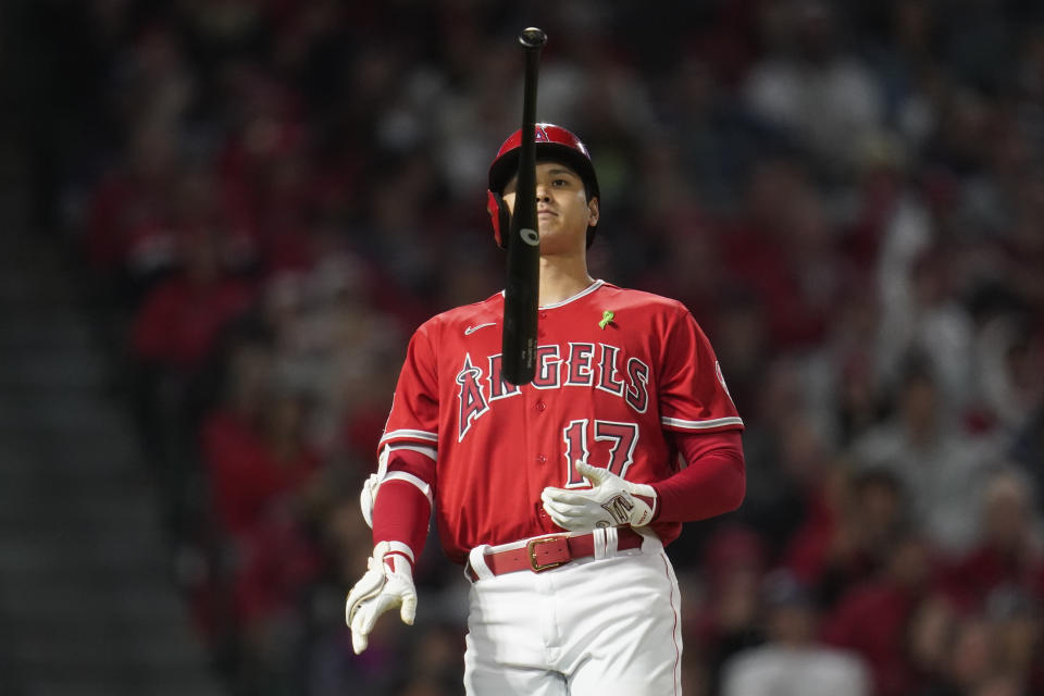 Los Angeles Angels designated hitter Shohei Ohtani (17) flips a bat after hitting a foul ball during the seventh inning of a baseball game against the Tampa Bay Rays in Anaheim, Calif., Tuesday, May 10, 2022. (AP Photo/Ashley Landis)