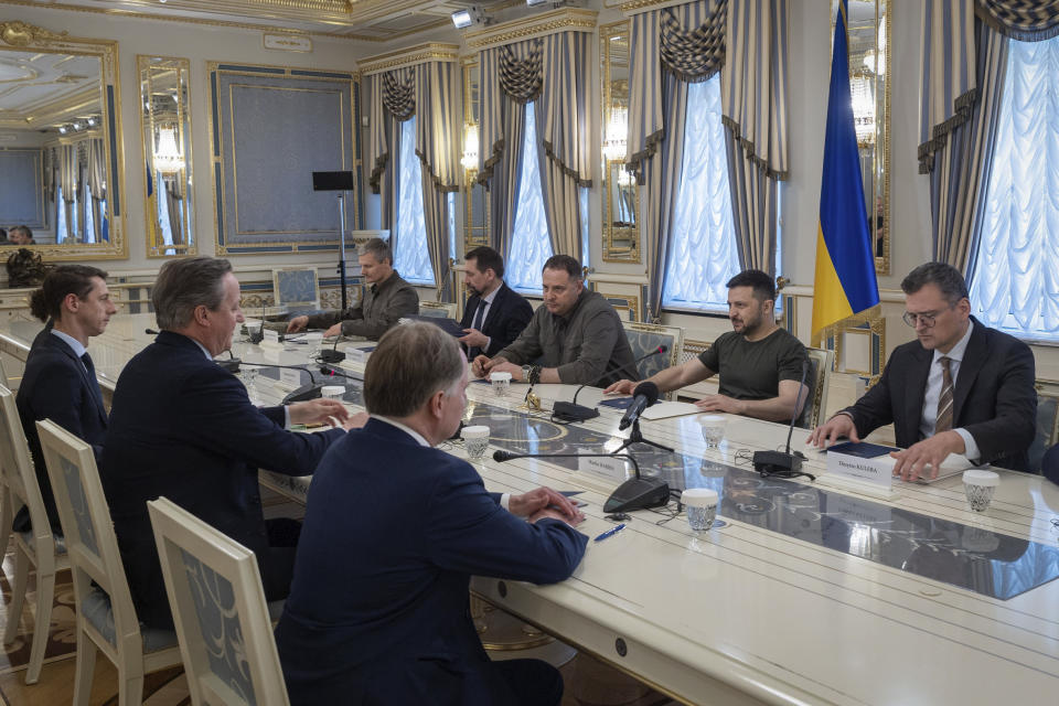 In this photo provided by the Ukrainian Presidential Press Office, Ukrainian President Volodymyr Zelenskyy talk with Britain's Foreign Secretary David Cameron in Kyiv, Ukraine, Thursday, May 2, 2024. (Ukrainian Presidential Press Office via AP)