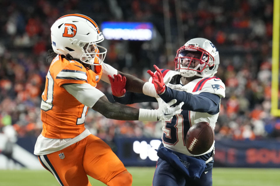 New England Patriots cornerback Jonathan Jones (31) deflects a pass intended for Denver Broncos wide receiver Jerry Jeudy (10) during the second half of an NFL football game, Sunday, Dec. 24, 2023, in Denver. (AP Photo/David Zalubowski)