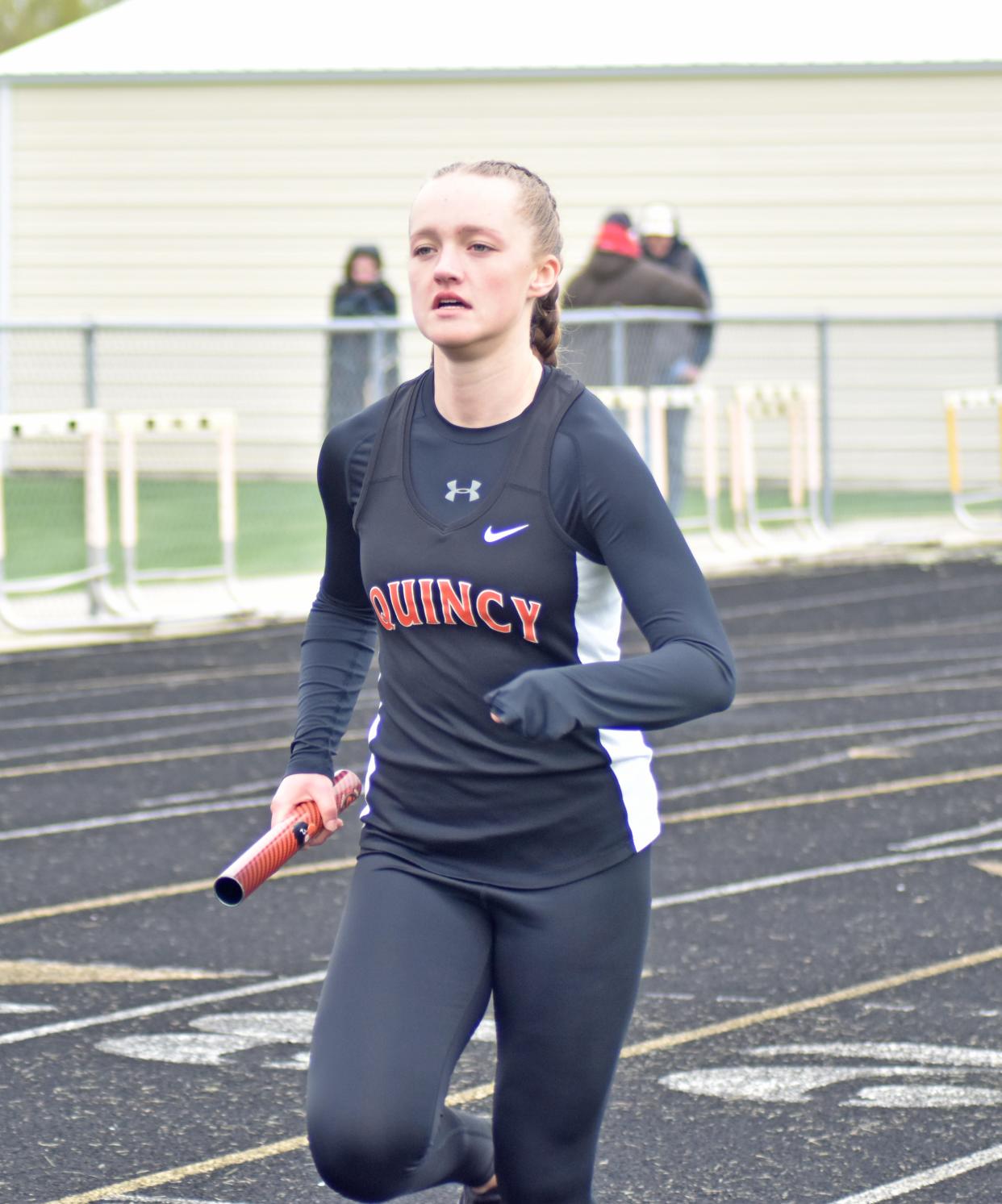 Quincy's Kendyl Musielewicz closes out the Orioles effort in the 3200 meter relay on Wednesday