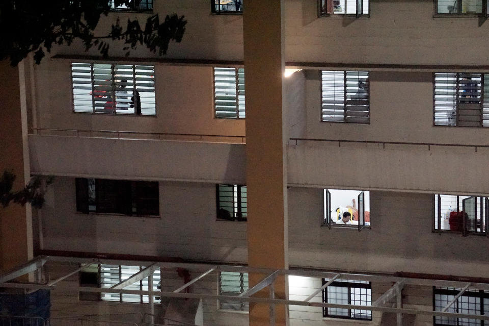 Migrant workers seen inside a formerly vacant HDB block at Redhill Close, which has been repurposed to accommodate healthy workers amid a spike in COVID-19 cases linked to foreign worker dormitories, on 10 April 2020. (PHOTO: Dhany Osman / Yahoo News Singapore)