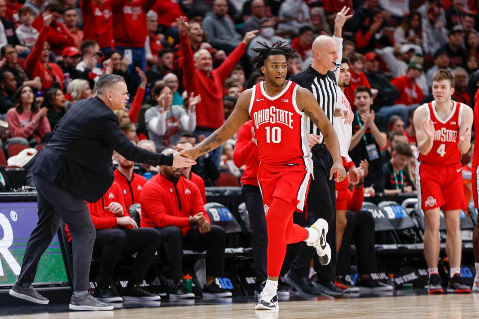 Mar 8, 2023; Chicago, IL, USA; Ohio State Buckeyes forward Brice Sensabaugh (10) is congratulated by head coach Chris Holtmann after scoring a three-pointer against the Wisconsin Badgers during the second half at United Center. Mandatory Credit: Kamil Krzaczynski-USA TODAY Sports