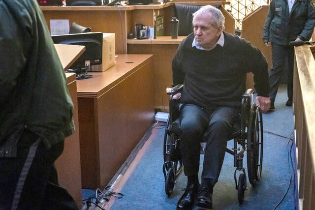 Robert Koehler, who authorities call the "Pillowcase Rapist," enters the courtroom in a wheelchair