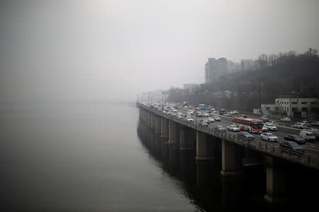 Vehicles move on a road on a polluted day in Seoul, South Korea, March 12, 2019. REUTERS/Kim Hong-ji