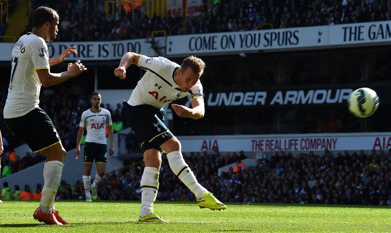 Tottenham Hotspur's Harry Kane (C) attempts a shot on goal during their English Premier League match against Aston Villa, at White Hart Lane in north London, on April 11, 2015