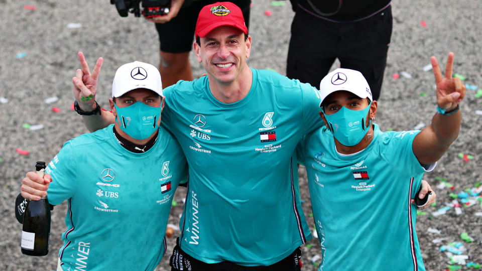 Mercedes F1 drivers Valtteri Bottas and Lewis Hamilton are pictured with team principal Toto Wolff.