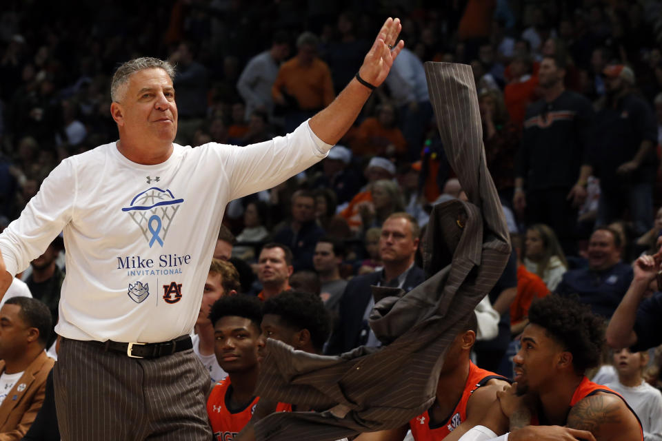 Auburn head coach Bruce Pearl throws his coat as he reacts to a call during the second half of an NCAA college basketball game against Saint Louis, Saturday, Dec. 14, 2019, in Birmingham, Ala. (AP Photo/Butch Dill)