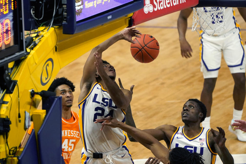 LSU guard Cameron Thomas (24) battles under the basket with Tennessee guard Keon Johnson (45) in the second half of an NCAA college basketball game in Baton Rouge, La., Saturday, Feb. 13, 2021. (AP Photo/Gerald Herbert)