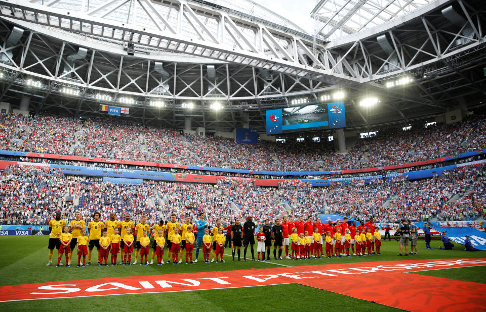 <p>Players line up during the national anthems before the match (REUTERS/Toru Hanai) </p>