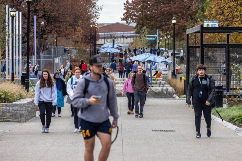 Pedestrians walk along Rose Street on the University of Kentucky campus in Lexington, Ky., on Thursday, Nov. 16, 2023.