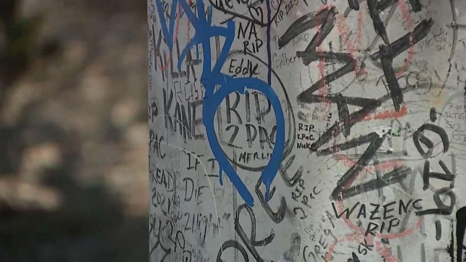 PHOTO: Memorials to Tupac Shakur stand near the intersection where he was fatally shot in Las Vegas, July 18, 2023. (KTNV)