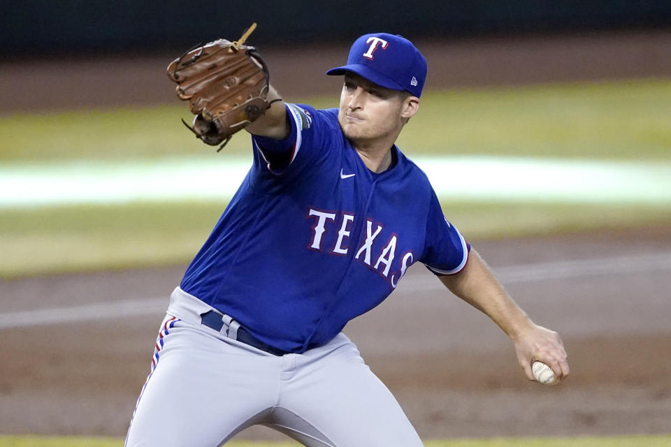 Texas Rangers starting pitcher Wes Benjamin throws against the Arizona Diamondbacks during the first inning of a baseball game, Wednesday, Sept. 23, 2020, in Phoenix. (AP Photo/Matt York)