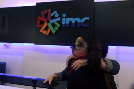 IMC TV employees react after their broadcaster's transmission cut by the authorities, based on a government decree, at IMC TV studios in Istanbul, Turkey, October 4, 2016. REUTERS/Huseyin Aldemir