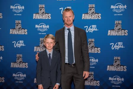 Jun 22, 2016; Las Vegas, NV, USA; Valter Sedin center Henrik Sedin (right) and his son Valter Sedin walk the red carpet during the 2016 NHL Awards at Hard Rock Hotel and Casino. Mandatory Credit: Joshua Dahl-USA TODAY Sports