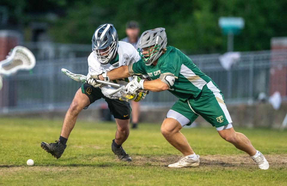 Pensacola Catholic's Jax Lagergren battles for the ball with a Trinity Catholic player during a Region 1-1A quarterfinal Saturday, April 22, 2023 at Catholic High School. Pensacola Catholic beat Trinity Catholic 12-8.