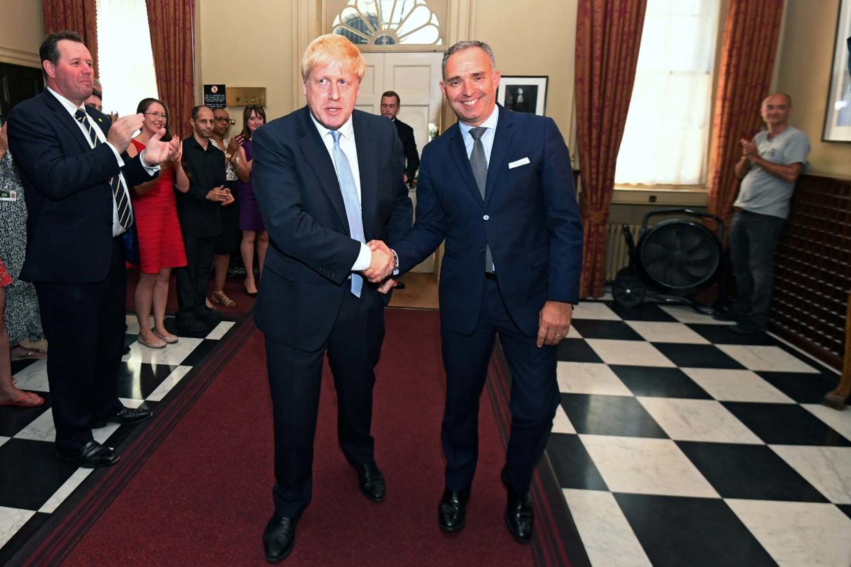 Boris Johnson shakes hands with Mark Sedwill following his appointment as Prime Minister: REUTERS