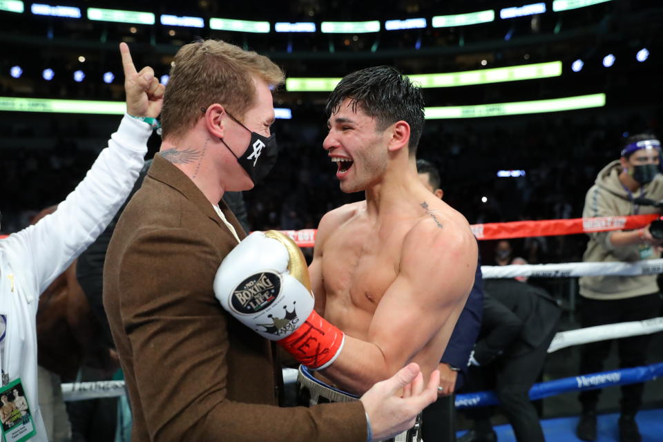 DALLAS, TEXAS - JANUARY 02: Ryan Garcia celebrates with Saul Canelo Alvarez after his victory against Luke Campbell at American Airlines Center on January 02, 2021 in Dallas, Texas. (Photo by Tom Hogan/Golden Boy Promotions via Getty Images)