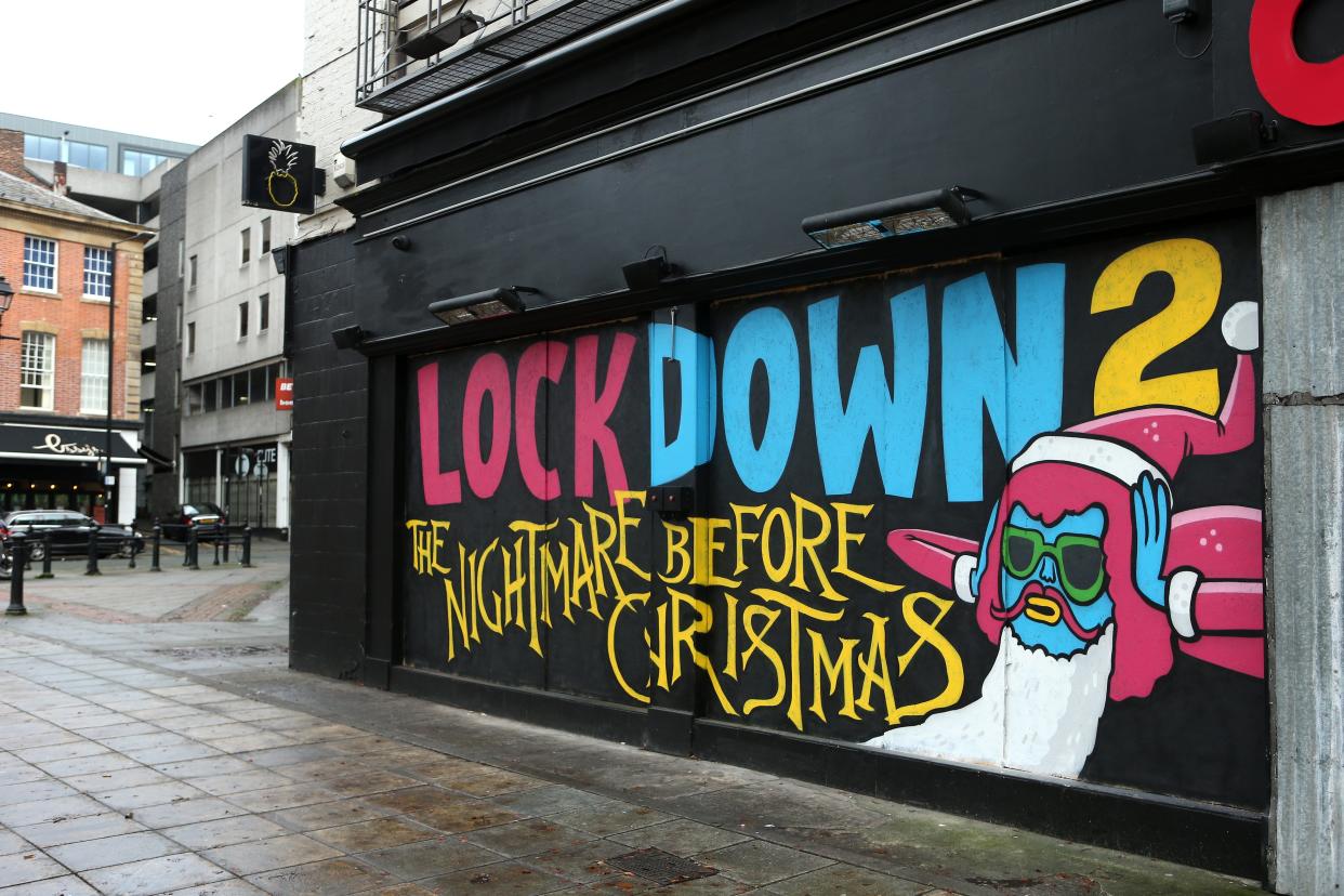 Street art that highlights the second lockdown is seen on the wall of Crazy Pedro’s in Manchester (Getty Images)