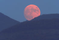 The moon rises over Karabakh mountains outside Stepanakert, the separatist region of Nagorno-Karabakh, Friday, Oct. 30, 2020. (AP Photo)