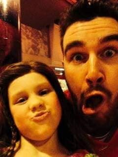 Berkeley Kemper, then 6, and Kansas City Chiefs tight end Travis Kelce made faces in 2014 while posing together. (Credit: The Kemper Family)