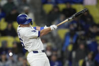 Los Angeles Dodgers' Will Smith connects for an RBI single during the fifth inning of a baseball game against the St. Louis Cardinals Saturday, March 30, 2024, in Los Angeles. (AP Photo/Jae C. Hong)
