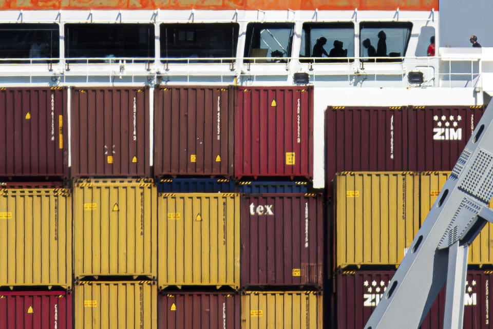 People are seen aboard the container ship Dali, Monday, April 15, 2024, in Baltimore. The FBI confirmed that agents were aboard the Dali conducting court-authorized law enforcement activity. (AP Photo/Julia Nikhinson)