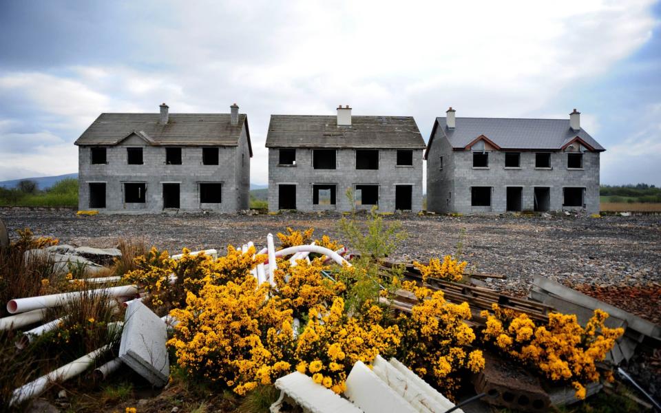 Unfinished homes sit empty on an abandoned housing development in Keshcarrigan, Ireland, in 2012 - Bloomberg News