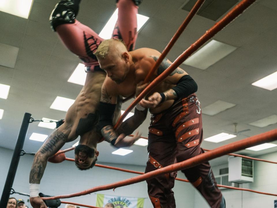 IWR United States Champion Trey Miguel tumbles into the crowd courtesy of Jake Crist at the Cinco De Mayhem event in Monroe.