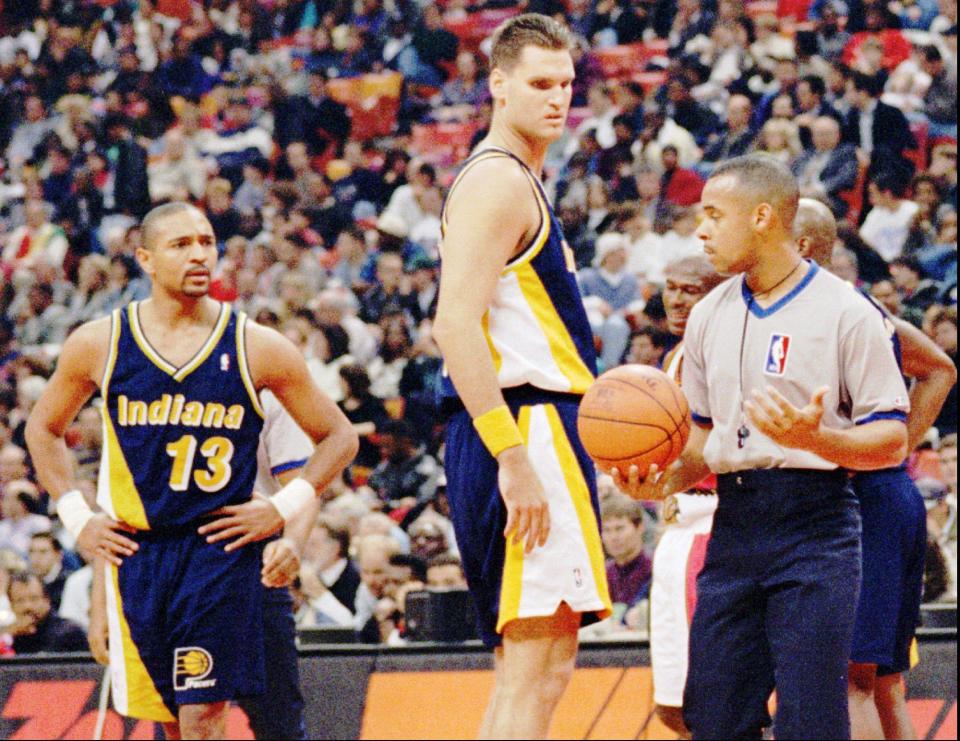 Dwayne Schintzius (55) looks disapprovingly at replacement referee Anthony Jordan in 1995. The talented college big man spent one season with the Pacers.