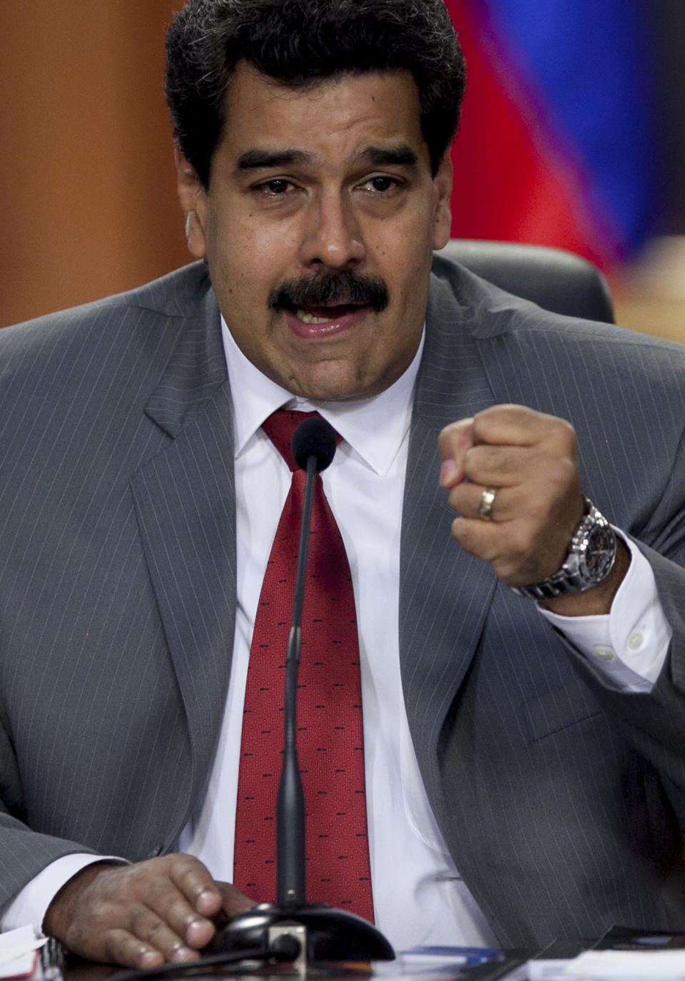 Venezuela's President Nicolas Maduro speaks during a press conference at the Miraflores presidential palace in Caracas, Venezuela, Friday, March 14, 2014. The Venezuelan government is stepping up security operations in Caracas and other cities where demonstrators are blocking streets, avenues and highways. Maduro said that those involved in creating road barricades will be arrested. (AP Photo/Alejandro Cegarra)