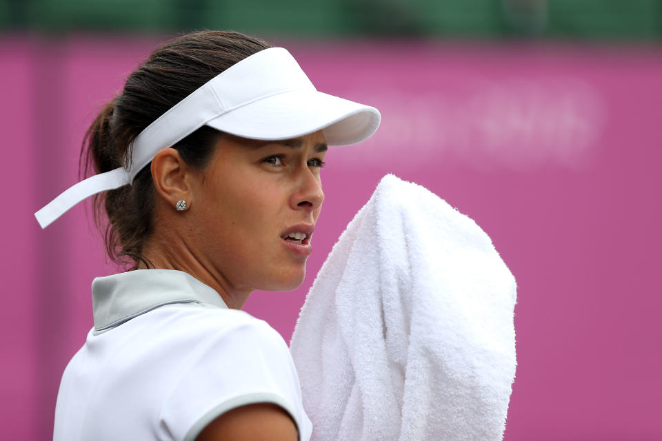 LONDON, ENGLAND - AUGUST 01: Ana Ivanovic of Serbia looks on against Kim Clijsters of Belgium on Day 5 of the London 2012 Olympic Games at Wimbledon on August 1, 2012 in London, England. (Photo by Clive Brunskill/Getty Images)