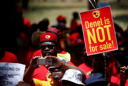 FILE PHOTO: Members of the National Union of Metalworkers of South Africa (NUMSA) hold placards during their march to the ministry of public enterprises in Pretoria, South Africa, November 9, 2018. REUTERS/Siphiwe Sibeko/File Photo
