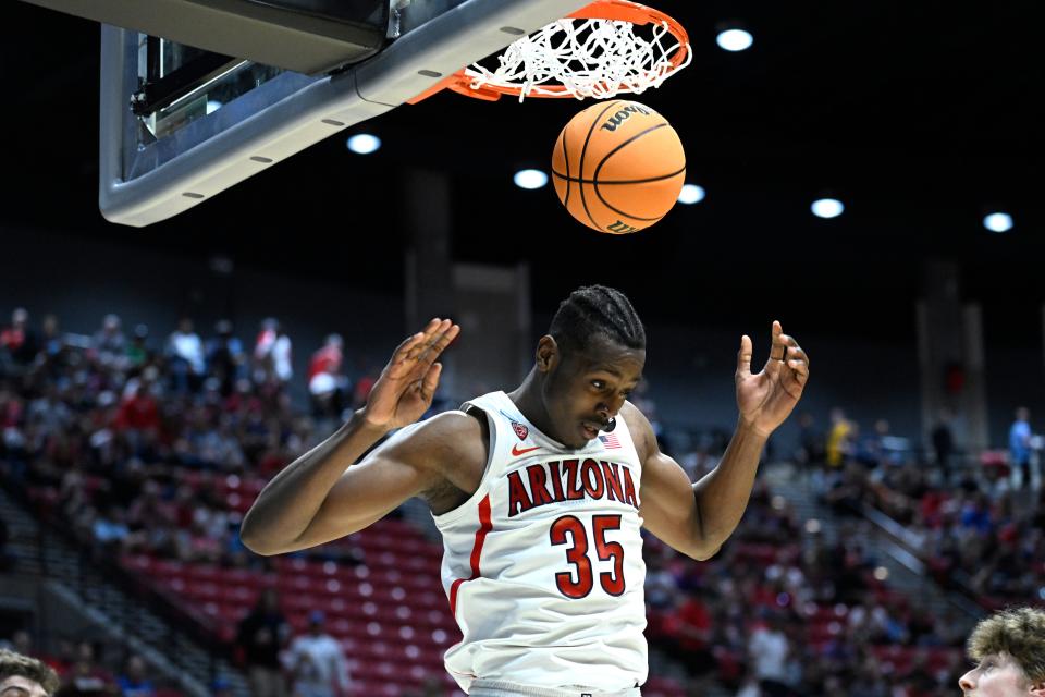 Arizona center Christian Koloko (35) comes down after a dunk against Wright State during the first half of a first-round NCAA college basketball tournament game, Friday, March 18, 2022, in San Diego. (AP Photo/Denis Poroy)