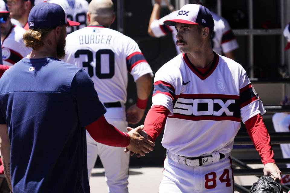 Chicago White Sox starting pitcher Dylan Cease, right, celebrates with Michael Kopech after the first inning of a baseball game against the Baltimore Orioles in Chicago, Sunday, June 26, 2022. (AP Photo/Nam Y. Huh)