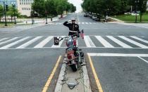 Marine SSGT Tim Chambers renders a salute paying respect for U.S. veterans on Memorial Day holiday in Washington