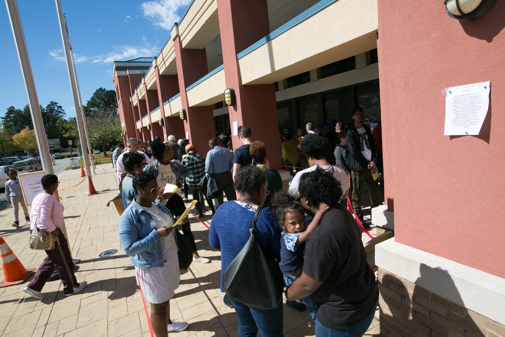 Voters wait in line for up to two hours to early vote at the Cobb County West Park Government Center on October 18, 2018 in Marietta, Georgia.