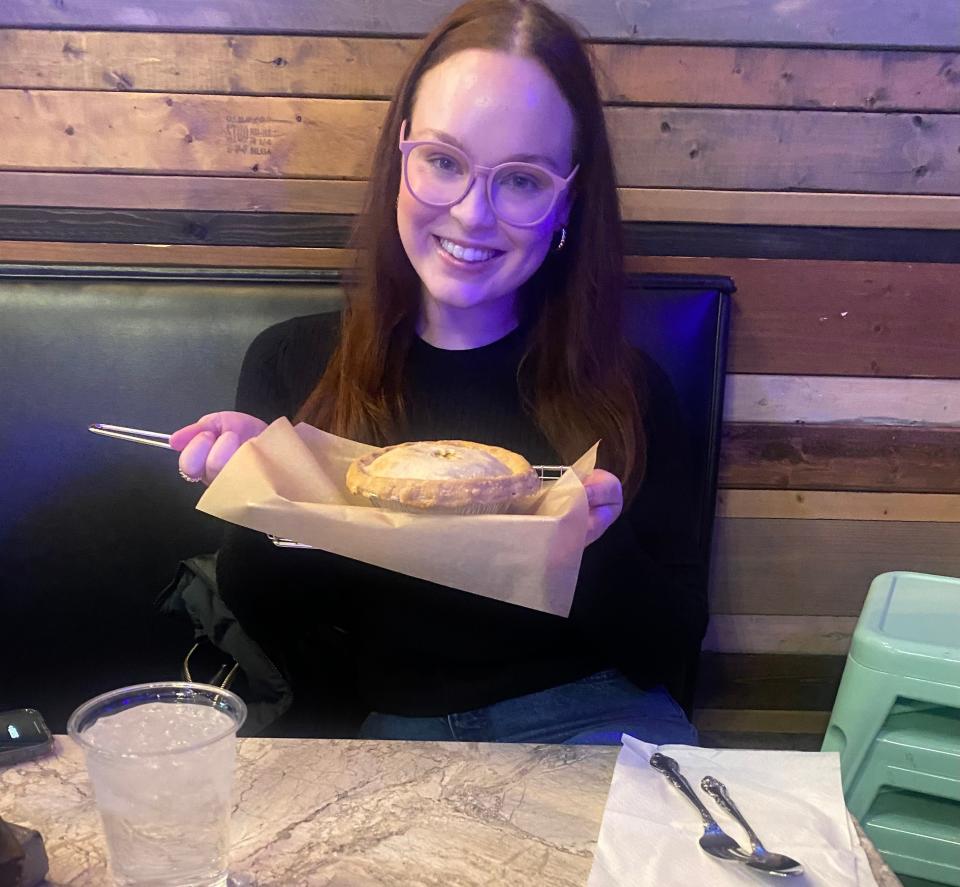 Taylor Shook holds a chicken pot pie at Sweet Tea Shakespeare's 20,000 Leagues Under the Sea, held at Fayetteville Pie Company, 253 Westwood Shopping Center, Jan. 27.