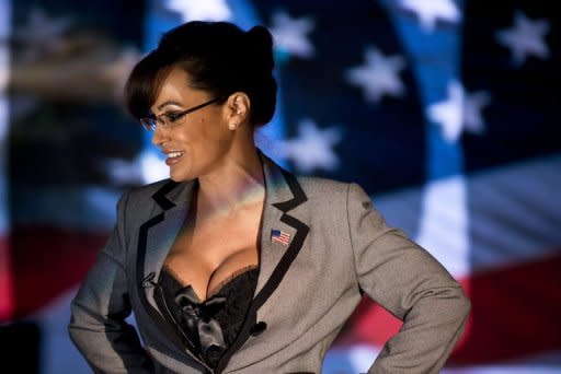 Lisa Ann, an adult film star and Sarah Palin tribute artist, speaks to members of the press at Thee DollHouse gentleman's club on August 25 in Tampa, Florida